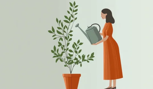 a woman watering the plant